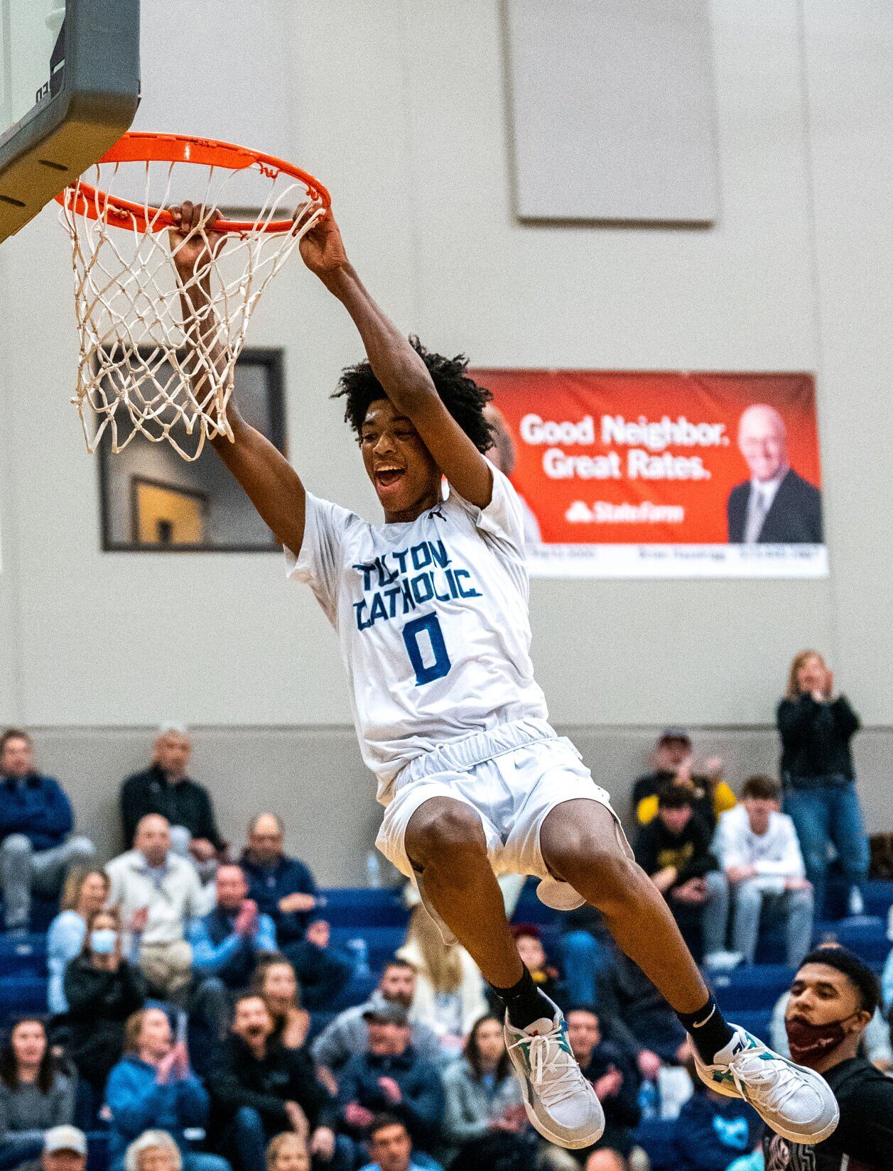 Father Tolton Catholic High School freshman Aaron Rowe cheers
